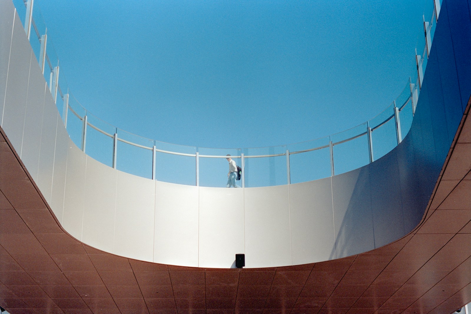 Photo by Zhen Yao Modern architecture with a person on a balcony